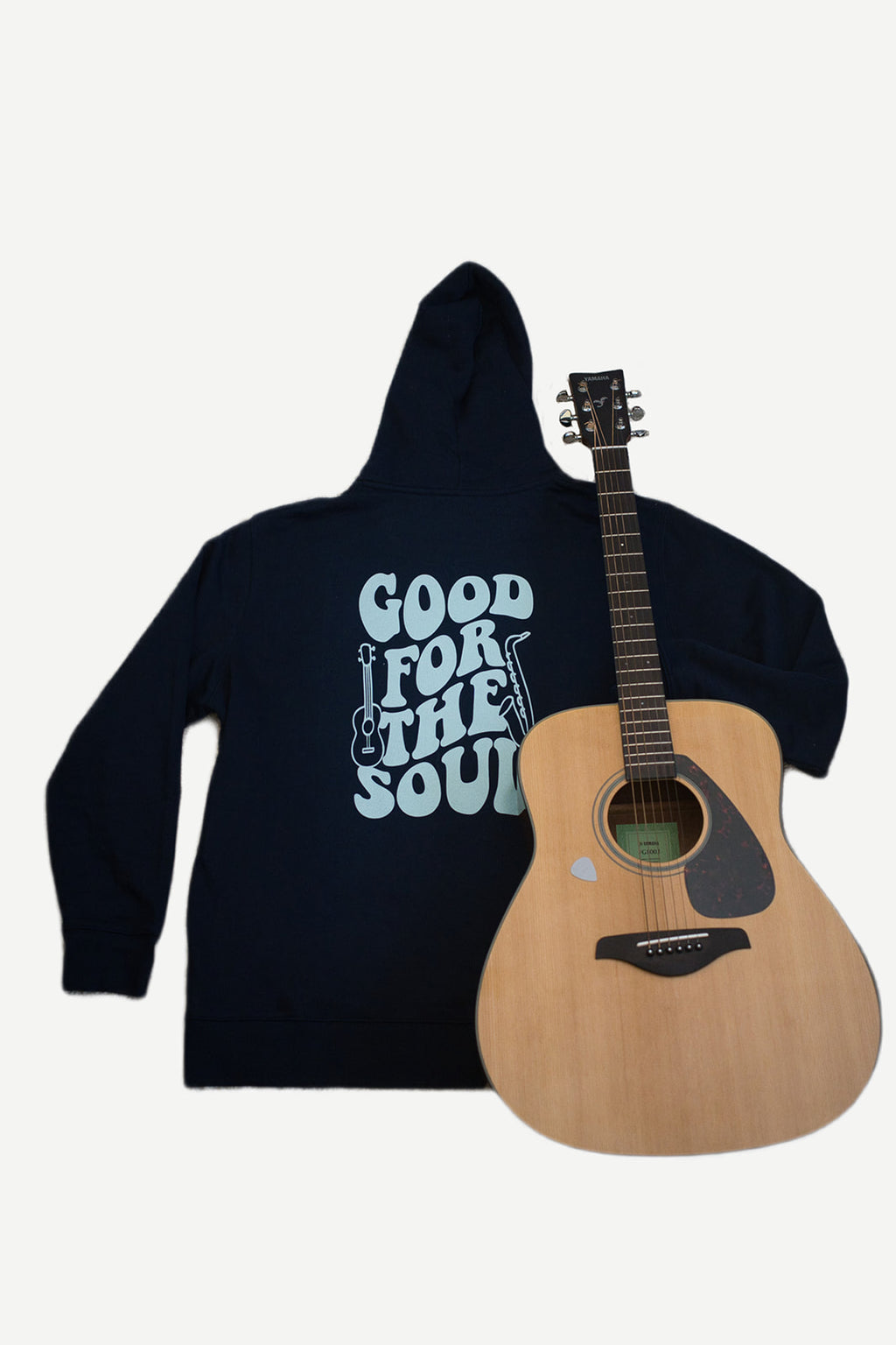 Navy blue hoodie with 'Good for the Soul' text and a wooden acoustic guitar on a white background
